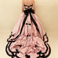 Pink satin ball gown model wearing back view 