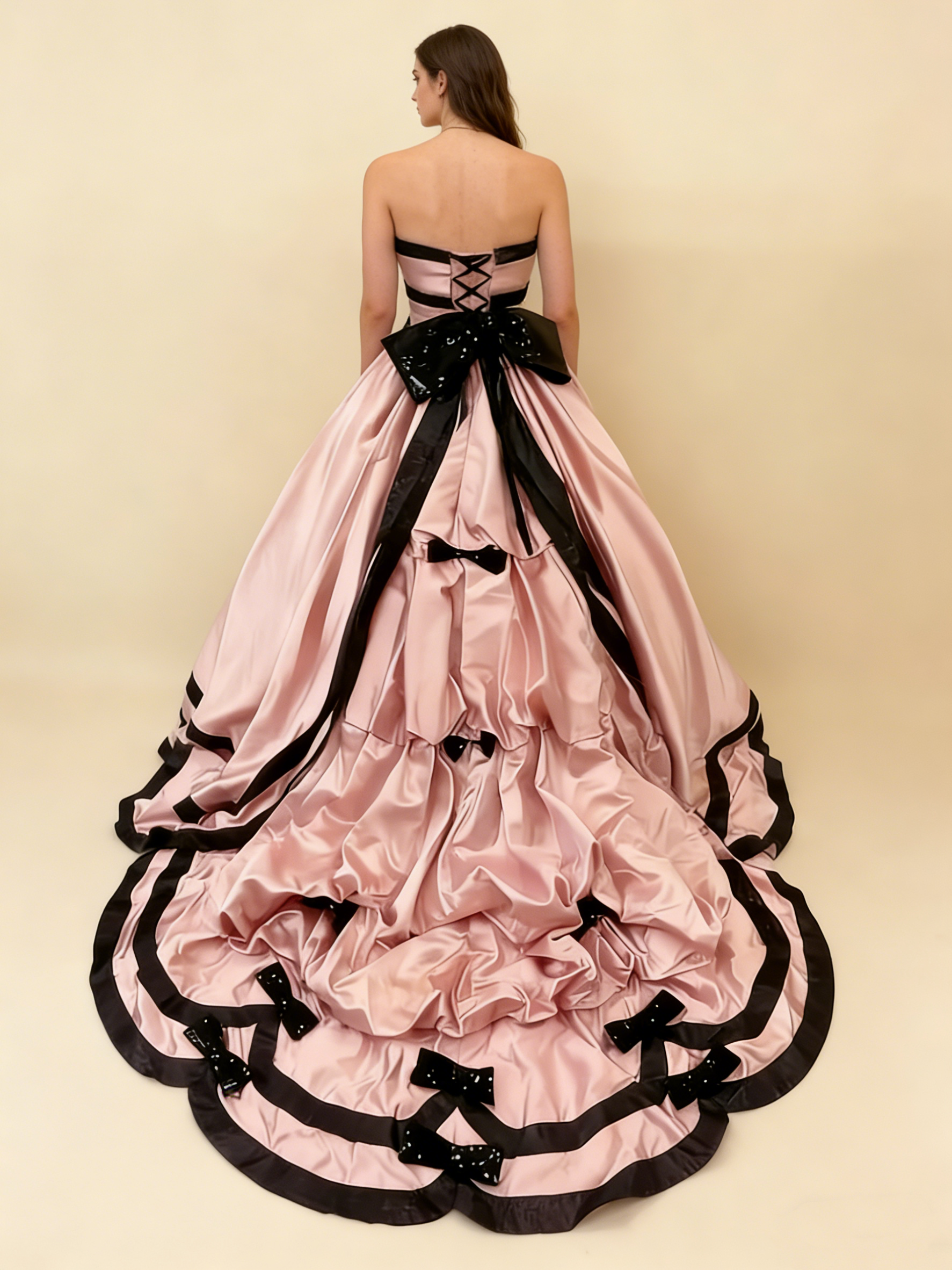 Pink satin ball gown model wearing back view 